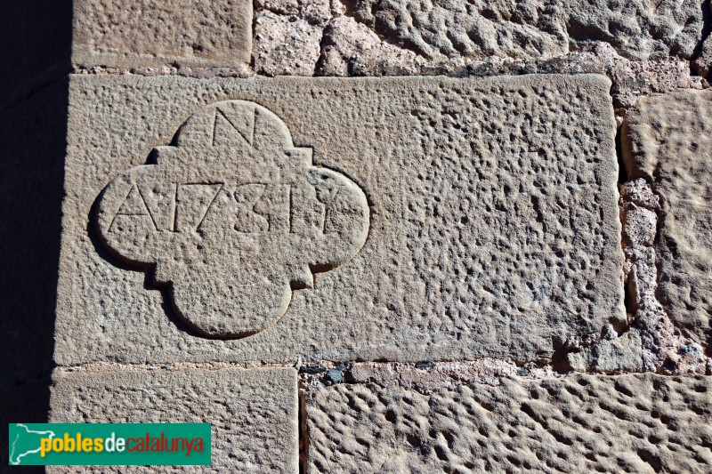 La Pobla de Cérvoles - Església de Santa Maria de la Junquera, Carreu amb la data de 1731 (Foto: Albert Esteves, 2020) La Pobla de Cérvoles - Església de Santa Maria de la Junquera, Carreu amb la data de 1731