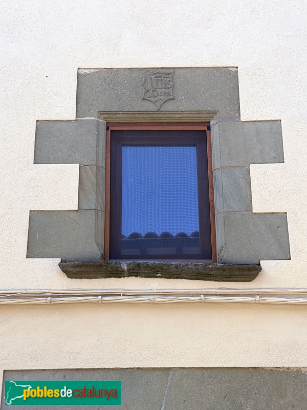 Sant Julià de Vilatorta - Carrer de la Mercè. Llinda de Cal Martinet (1571)